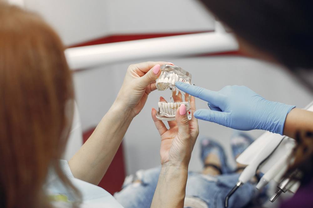 Beautiful girl sitting in the dentist’s office
